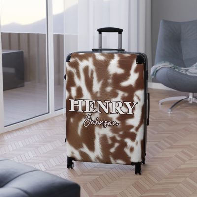 Custom Cowhide Suitcase - A personalized luggage adorned with a unique design, perfect for travelers who want to add a touch of individuality to their journeys.