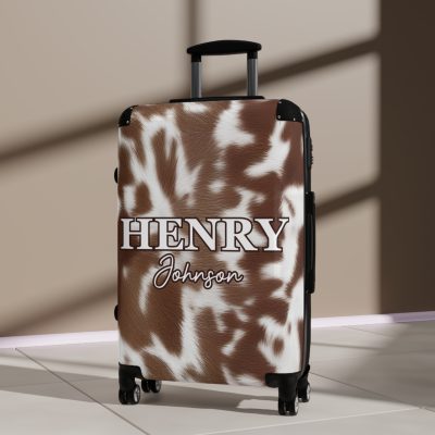 Custom Cowhide Suitcase - A personalized luggage adorned with a unique design, perfect for travelers who want to add a touch of individuality to their journeys.