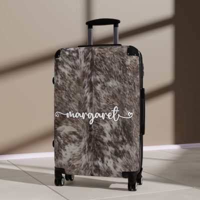 Custom Cowhide Suitcase - A personalized luggage adorned with a unique design, perfect for travelers who want to add a touch of individuality to their journeys.