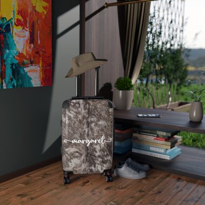 Custom Cowhide Suitcase - A personalized luggage adorned with a unique design, perfect for travelers who want to add a touch of individuality to their journeys.