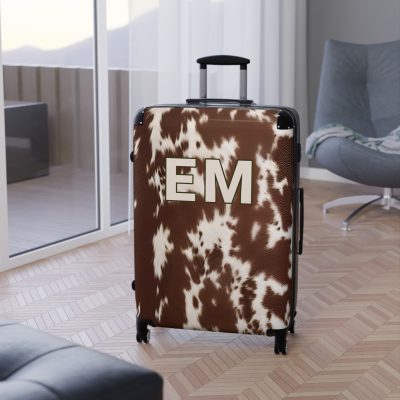 Custom Cowhide Suitcase - A personalized luggage adorned with a unique design, perfect for travelers who want to add a touch of individuality to their journeys.