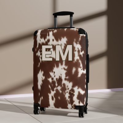 Custom Cowhide Suitcase - A personalized luggage adorned with a unique design, perfect for travelers who want to add a touch of individuality to their journeys.