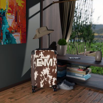 Custom Cowhide Suitcase - A personalized luggage adorned with a unique design, perfect for travelers who want to add a touch of individuality to their journeys.