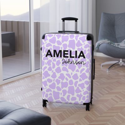 Custom Cow Print Suitcase - A personalized luggage adorned with a unique cow print design, perfect for travelers who want to add a touch of individuality to their journeys.