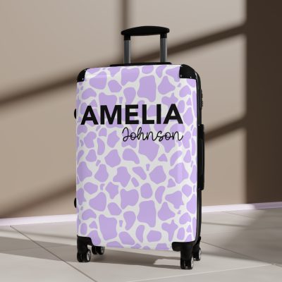 Custom Cow Print Suitcase - A personalized luggage adorned with a unique cow print design, perfect for travelers who want to add a touch of individuality to their journeys.