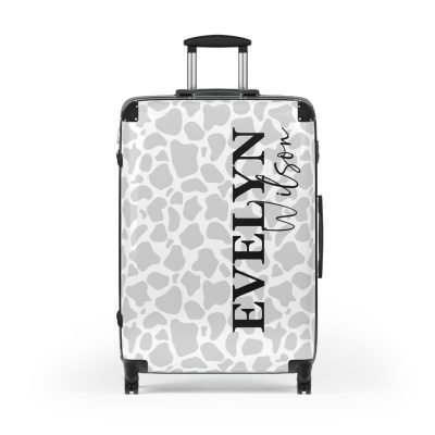 Custom Cow Print Suitcase - A personalized luggage adorned with a unique cow print design, perfect for travelers who want to add a touch of individuality to their journeys.