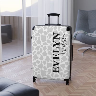 Custom Cow Print Suitcase - A personalized luggage adorned with a unique cow print design, perfect for travelers who want to add a touch of individuality to their journeys.