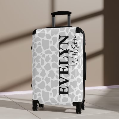 Custom Cow Print Suitcase - A personalized luggage adorned with a unique cow print design, perfect for travelers who want to add a touch of individuality to their journeys.