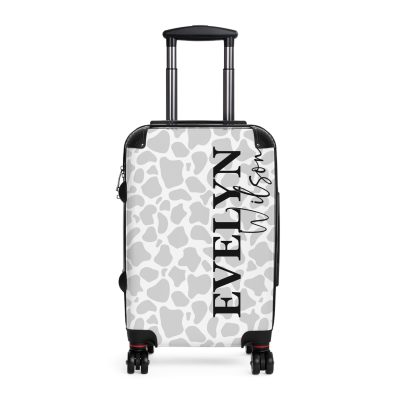 Custom Cow Print Suitcase - A personalized luggage adorned with a unique cow print design, perfect for travelers who want to add a touch of individuality to their journeys.