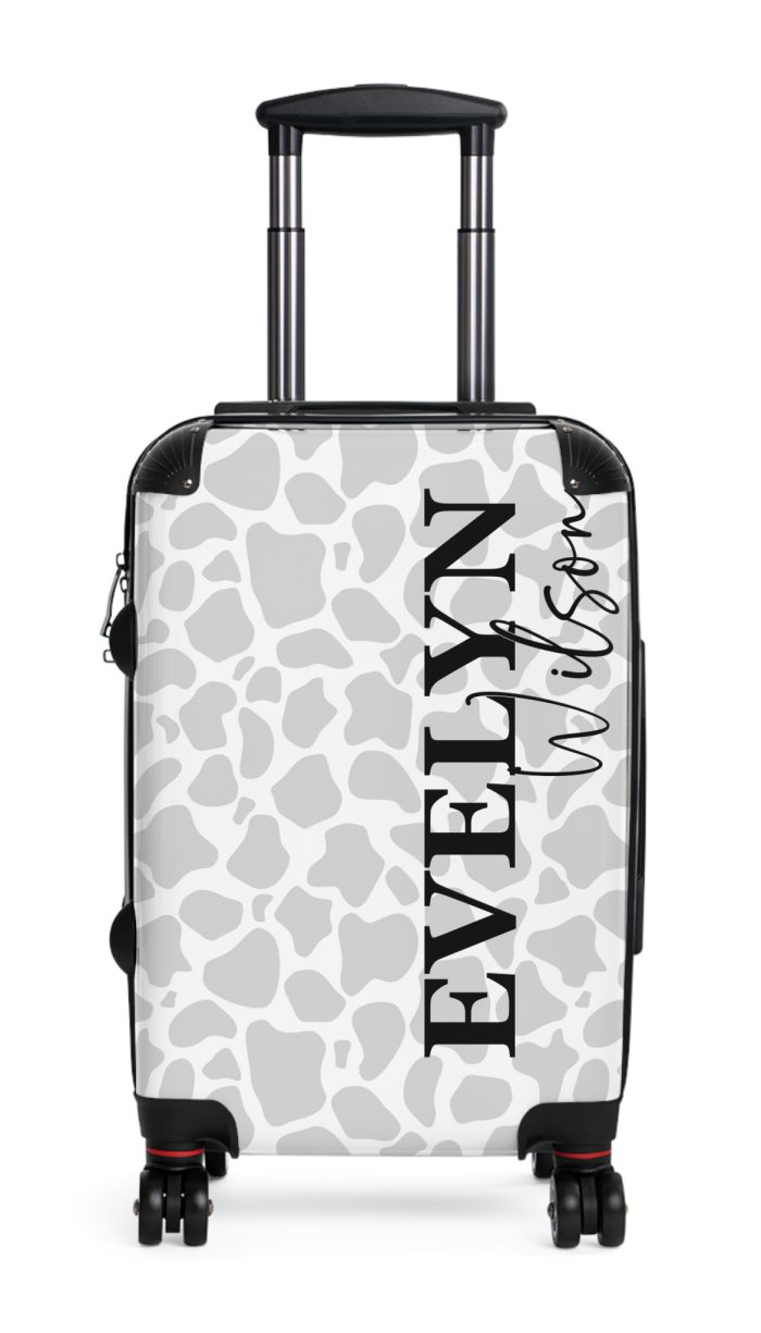 Custom Cow Print Suitcase - A personalized luggage adorned with a unique cow print design, perfect for travelers who want to add a touch of individuality to their journeys.