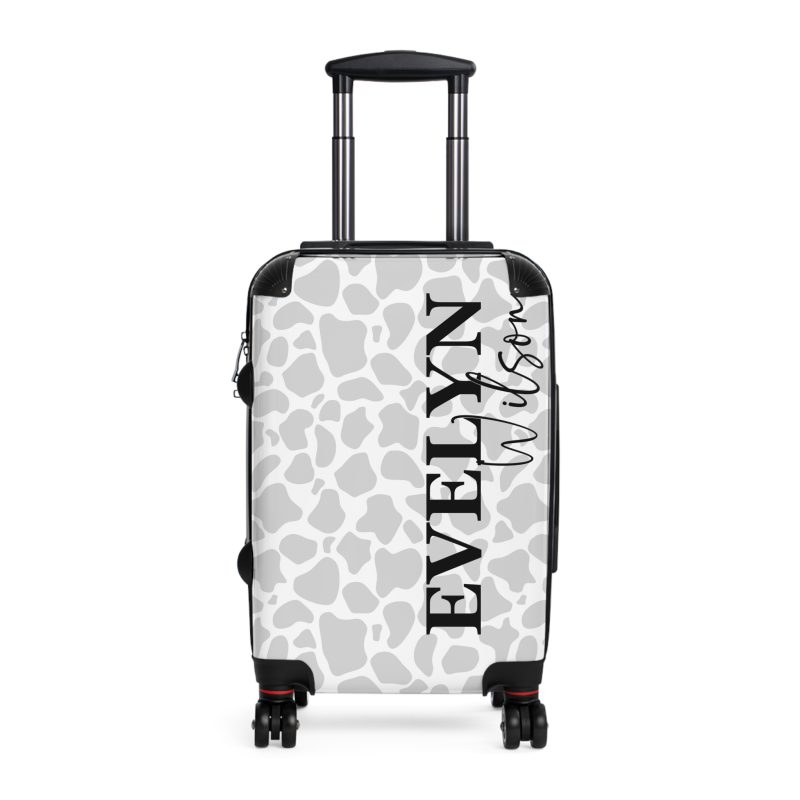 Custom Cow Print Suitcase - A personalized luggage adorned with a unique cow print design, perfect for travelers who want to add a touch of individuality to their journeys.