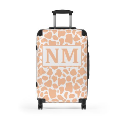 Custom Cow Print Suitcase - A personalized luggage adorned with a unique cow print design, perfect for travelers who want to add a touch of individuality to their journeys.