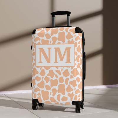 Custom Cow Print Suitcase - A personalized luggage adorned with a unique cow print design, perfect for travelers who want to add a touch of individuality to their journeys.