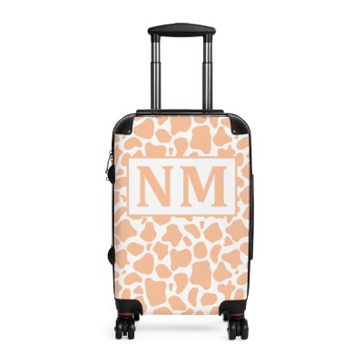 Custom Cow Print Suitcase - A personalized luggage adorned with a unique cow print design, perfect for travelers who want to add a touch of individuality to their journeys.