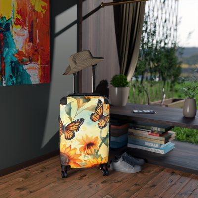 Butterfly Sunflower Suitcase - A luggage adorned with a bright sunflower and butterfly design, perfect for travelers who want to bring a touch of nature and cheer to their journeys.