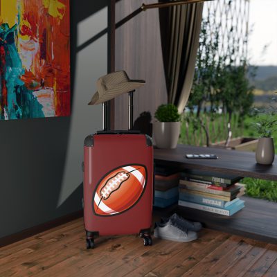 Football Suitcase - A luggage adorned with a sporty football-themed design, perfect for travelers who want to travel in style with their favorite sport.