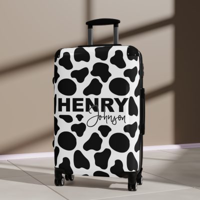 Custom Cow Print Suitcase - A personalized luggage adorned with a unique cow print design, perfect for travelers who want to add a touch of individuality to their journeys.