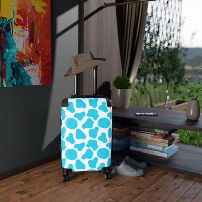 Cow Print Suitcase - A stylish luggage featuring a chic cow print design, perfect for travelers who want to add a touch of luxury to their journeys.