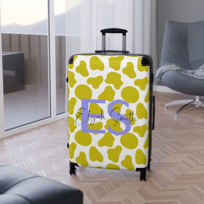 Custom Cow Print Suitcase - A personalized luggage adorned with a unique cow print design, perfect for travelers who want to add a touch of individuality to their journeys.