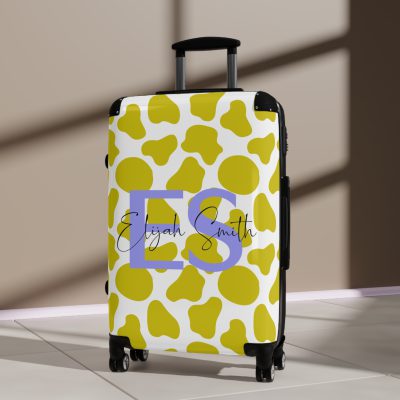 Custom Cow Print Suitcase - A personalized luggage adorned with a unique cow print design, perfect for travelers who want to add a touch of individuality to their journeys.