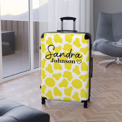 Custom Cow Print Suitcase - A personalized luggage adorned with a unique cow print design, perfect for travelers who want to add a touch of individuality to their journeys.