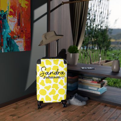 Custom Cow Print Suitcase - A personalized luggage adorned with a unique cow print design, perfect for travelers who want to add a touch of individuality to their journeys.