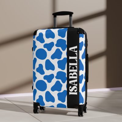 Custom Cow Print Suitcase - A personalized luggage adorned with a unique cow print design, perfect for travelers who want to add a touch of individuality to their journeys.