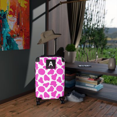 Custom Cow Print Suitcase - A personalized luggage adorned with a unique cow print design, perfect for travelers who want to add a touch of individuality to their journeys.