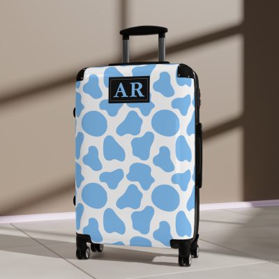 Custom Cow Print Suitcase - A personalized luggage adorned with a unique cow print design, perfect for travelers who want to add a touch of individuality to their journeys.