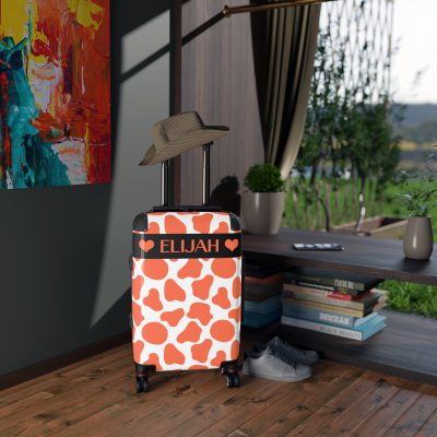 Custom Cow Print Suitcase - A personalized luggage adorned with a unique cow print design, perfect for travelers who want to add a touch of individuality to their journeys.