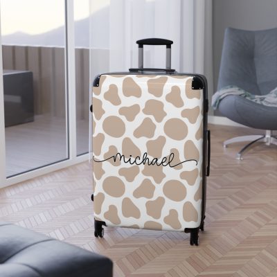 Custom Cow Print Suitcase - A personalized luggage adorned with a unique cow print design, perfect for travelers who want to add a touch of individuality to their journeys.