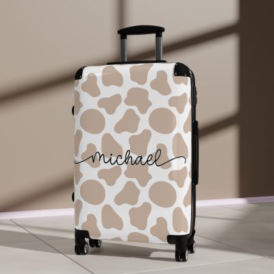 Custom Cow Print Suitcase - A personalized luggage adorned with a unique cow print design, perfect for travelers who want to add a touch of individuality to their journeys.