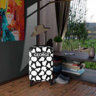 Custom Cow Print Suitcase - A personalized luggage adorned with a unique cow print design, perfect for travelers who want to add a touch of individuality to their journeys.