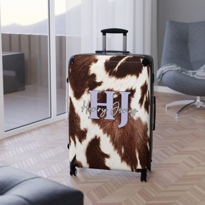 Custom Cowhide Suitcase - A personalized luggage adorned with a unique design, perfect for travelers who want to add a touch of individuality to their journeys.