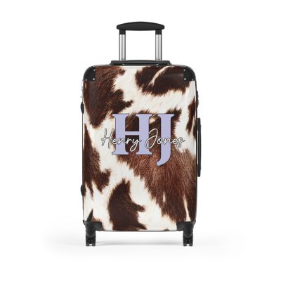 Custom Cowhide Suitcase - A personalized luggage adorned with a unique design, perfect for travelers who want to add a touch of individuality to their journeys.