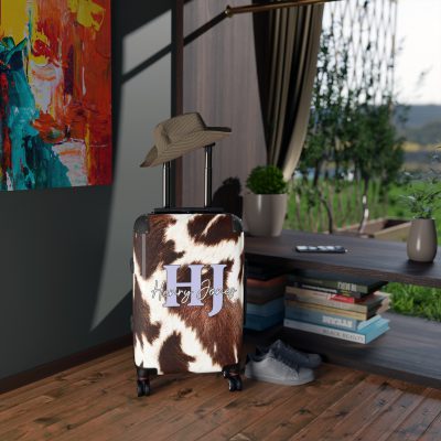 Custom Cowhide Suitcase - A personalized luggage adorned with a unique design, perfect for travelers who want to add a touch of individuality to their journeys.