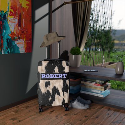 Custom Cowhide Suitcase - A personalized luggage adorned with a unique design, perfect for travelers who want to add a touch of individuality to their journeys.