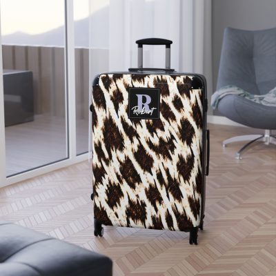 Custom Cowhide Suitcase - A personalized luggage adorned with a unique design, perfect for travelers who want to add a touch of individuality to their journeys.