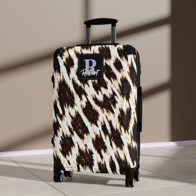 Custom Cowhide Suitcase - A personalized luggage adorned with a unique design, perfect for travelers who want to add a touch of individuality to their journeys.