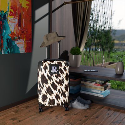 Custom Cowhide Suitcase - A personalized luggage adorned with a unique design, perfect for travelers who want to add a touch of individuality to their journeys.