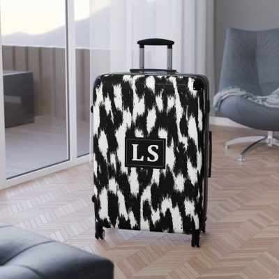 Custom Cowhide Suitcase - A personalized luggage adorned with a unique design, perfect for travelers who want to add a touch of individuality to their journeys.