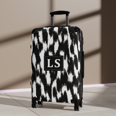 Custom Cowhide Suitcase - A personalized luggage adorned with a unique design, perfect for travelers who want to add a touch of individuality to their journeys.