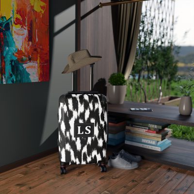 Custom Cowhide Suitcase - A personalized luggage adorned with a unique design, perfect for travelers who want to add a touch of individuality to their journeys.