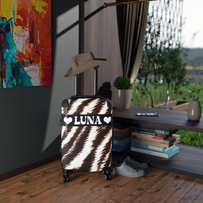 Custom Cowhide Suitcase - A personalized luggage adorned with a unique design, perfect for travelers who want to add a touch of individuality to their journeys.