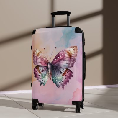 An exquisite pink suitcase featuring intricate butterfly patterns, embodying a perfect balance of style and resilience.