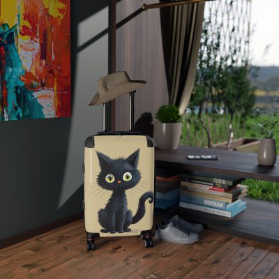 Black Cat Suitcase - A stylish travel companion featuring a sleek black design adorned with charming cat illustrations for a touch of whimsy.