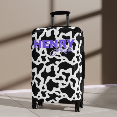 Custom Cow Print Suitcase - A personalized luggage adorned with a unique cow print design, perfect for travelers who want to add a touch of individuality to their journeys.