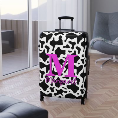 Custom Cow Print Suitcase - A personalized luggage adorned with a unique cow print design, perfect for travelers who want to add a touch of individuality to their journeys.