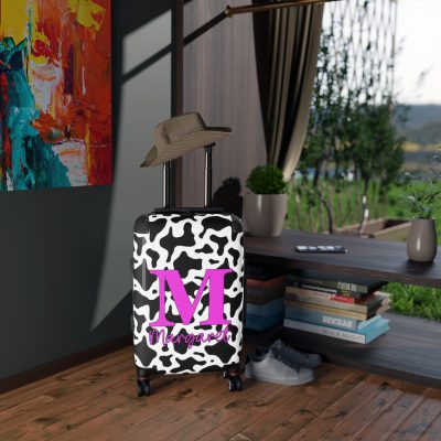 Custom Cow Print Suitcase - A personalized luggage adorned with a unique cow print design, perfect for travelers who want to add a touch of individuality to their journeys.