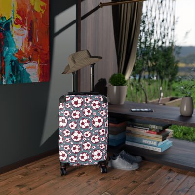 Soccer Suitcase - A luggage adorned with a sporty soccer-themed design, perfect for travelers who want to travel in style with their favorite sport.